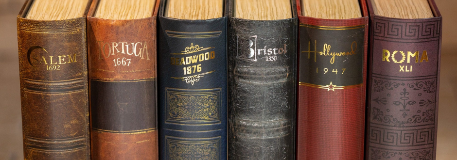 Collection of Facade Games Dark Cities series designed like decorative vintage books