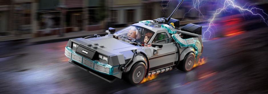 A LEGO DeLorean car races down a street with trail effects and lightning in the background. Two minifigures are seated inside, conveying excitement and adventure.