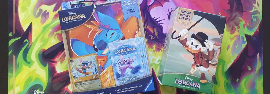 The Disney Lorcana Scrooge McDuck Gift Box and the Winterspell - Stitch Collection Starter Set displayed against a Lorcana playmat