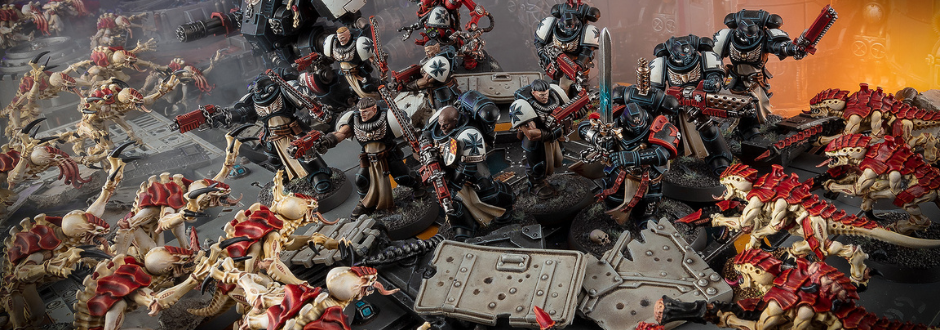 A group of armored soldiers, wielding various weapons, battles against alien creatures on a metallic battlefield. The scene conveys tension and action.