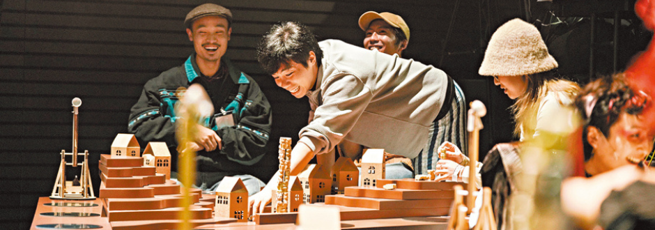 A photo taken of people at the board game event playing