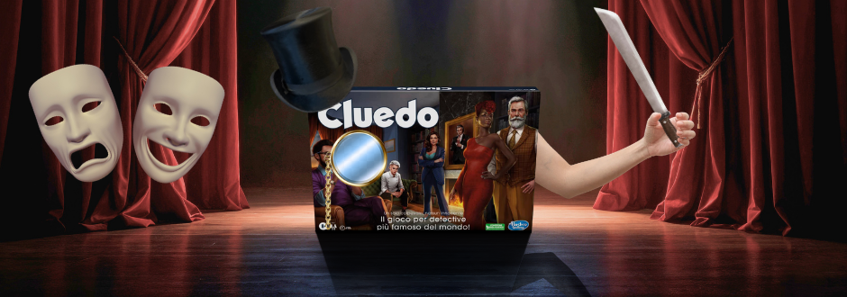 A Cluedo Box on stage with a monocle and a top hat with an arm holding a knife, there are also 2 theater masks on the left