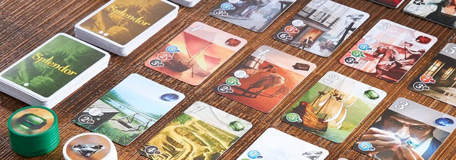 Splendor cards arranged in lines on a wooden table