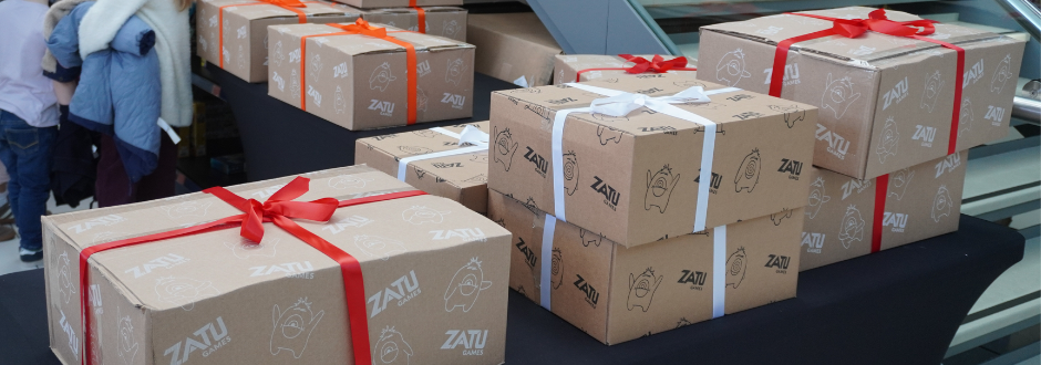 Zatu Games mystery boxes displayed on a table