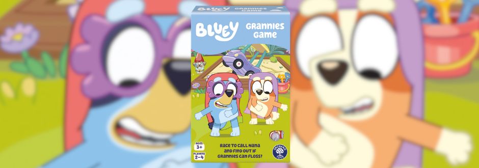 The image features a colorful box of the "Bluey Grannies Game" with illustrated characters of two dogs in costumes. The background is a vibrant, playful scene.