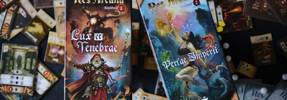 Two board game boxes, "Lux et Tenebrae" and "Perlae Imperii," are displayed over scattered game cards and pieces. The tone is adventurous and mystical.