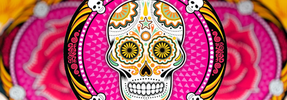 Vibrant Day of the Dead sugar skull with intricate orange and green patterns, set against a bright pink background. Festive and colorful mood.