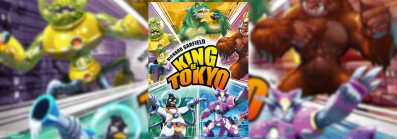 Colorful cover of "King of Tokyo" game shows fierce monsters in battle. Central green creature, dynamic poses, evoke excitement and chaos.